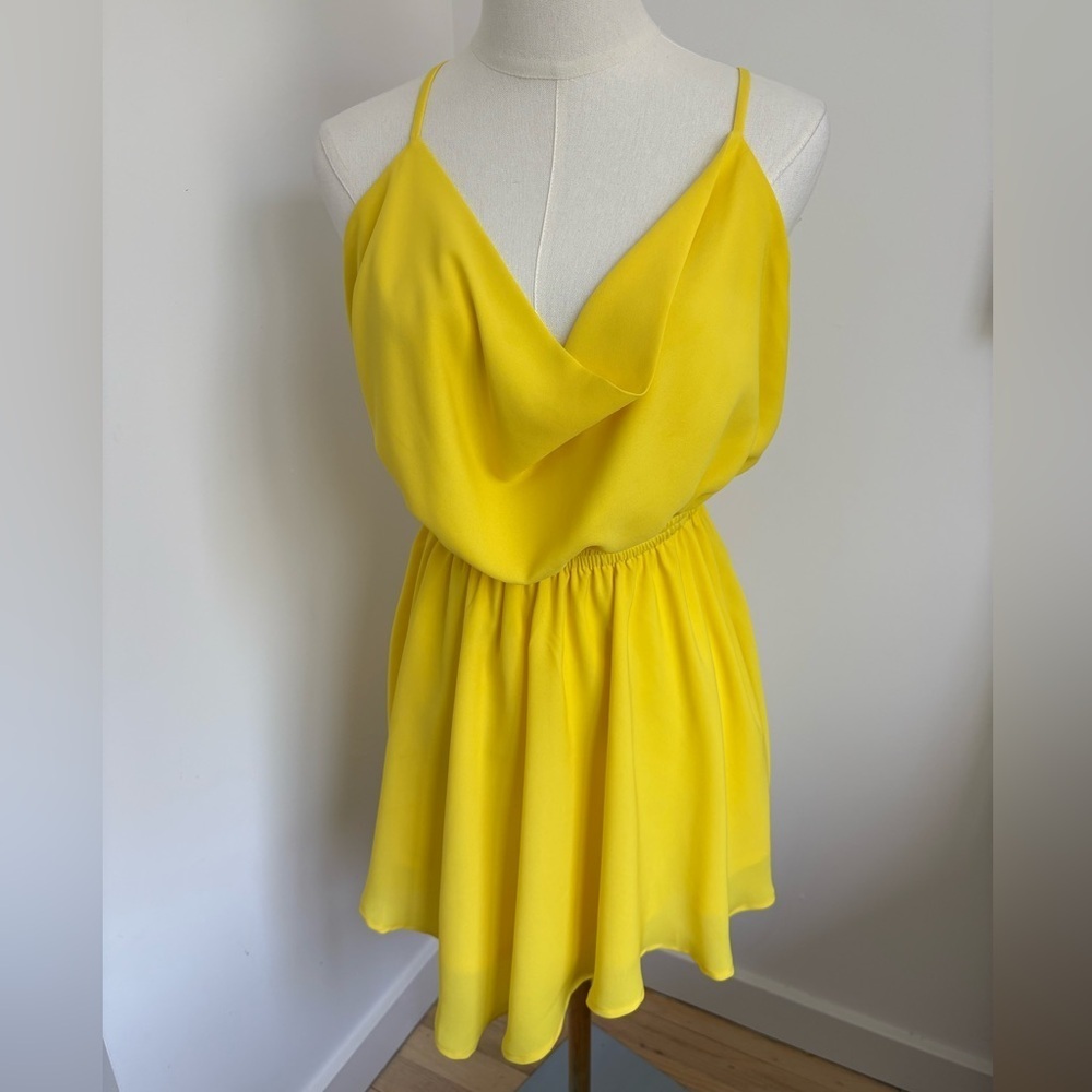 Yellow Mini Dress with Ruffled Hem and Sleeveless Design